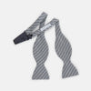 View 2 of product The Turnbull & Asser Blue Multi Puppytooth Silk Bow Tie features a classic puppytooth pattern in shades of blue, displayed against a plain white background.