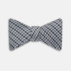 View 1 of product The Turnbull & Asser Blue Multi Puppytooth Silk Bow Tie features a classic puppytooth pattern in shades of blue, displayed against a plain white background.