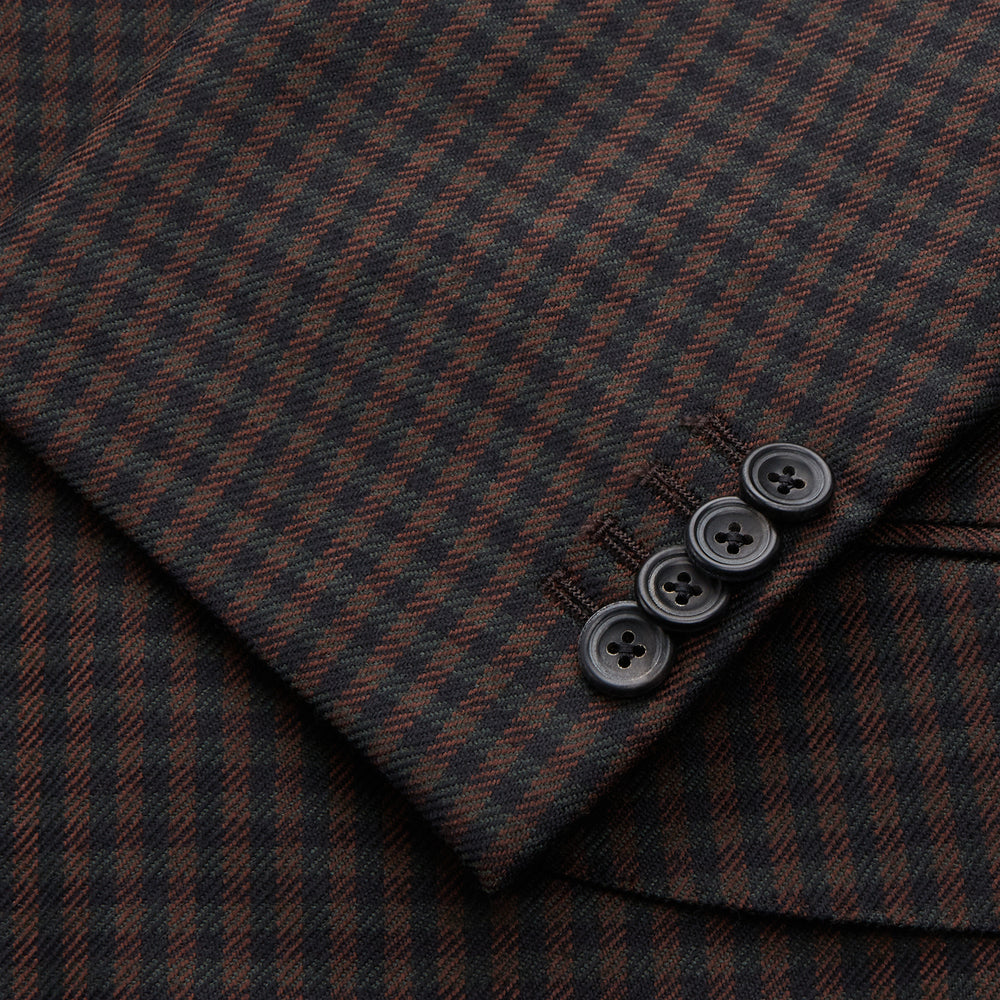 The Turnbull & Asser Brown and Navy Checked Wool Barrington Blazer, tailored in Italy with notched lapels, a chest pocket, two front flap pockets, and a single-breasted closure, is shown on a plain white background.