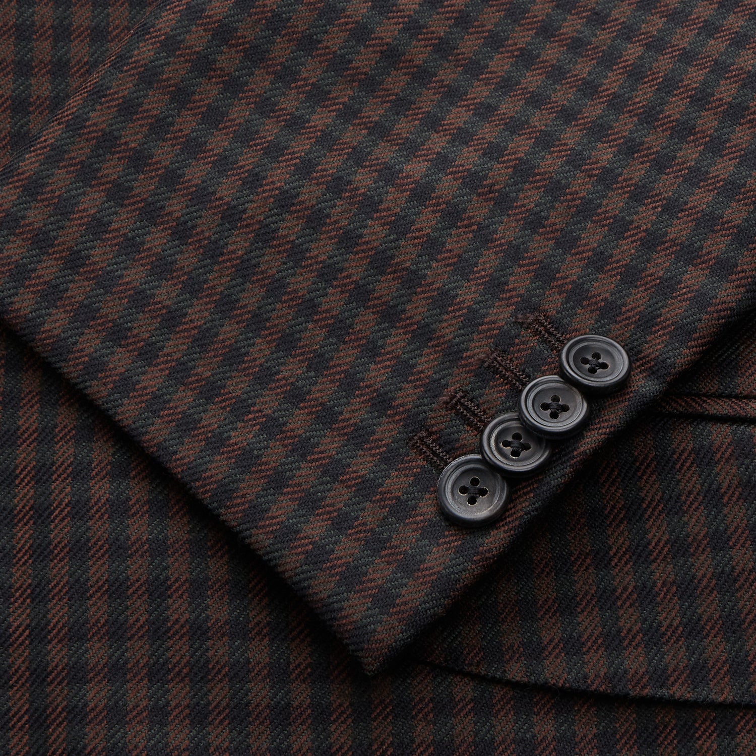 View 3 of product The Turnbull & Asser Brown and Navy Checked Wool Barrington Blazer, tailored in Italy with notched lapels, a chest pocket, two front flap pockets, and a single-breasted closure, is shown on a plain white background.
