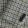 View 3 of product The Grey and Navy Tweed Barrington Blazer by Turnbull & Asser is a single-breasted jacket with notched lapels, two front buttons, flap pockets, and a tailored fit—expertly made in Italy for sophisticated style.