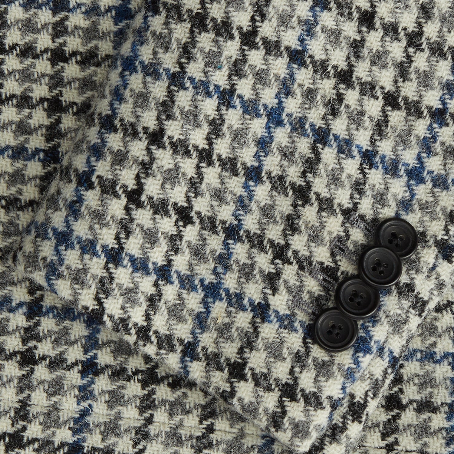 View 3 of product The Grey and Navy Tweed Barrington Blazer by Turnbull & Asser is a single-breasted jacket with notched lapels, two front buttons, flap pockets, and a tailored fit—expertly made in Italy for sophisticated style.