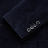 View 2 of product The Turnbull & Asser Navy Cord Bern Blazer, featuring notched lapels, a single button closure, two front pockets, and buttoned cuffs, exemplifies refined Italian tailoring and is shown laid flat on a white background.