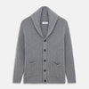 View 1 of product The Turnbull & Asser Grey Ribbed Cashmere Ainsley Cardigan is a luxury 3-ply cashmere knit with a shawl collar, button-up front, and two front pockets, shown laid flat on a white background.