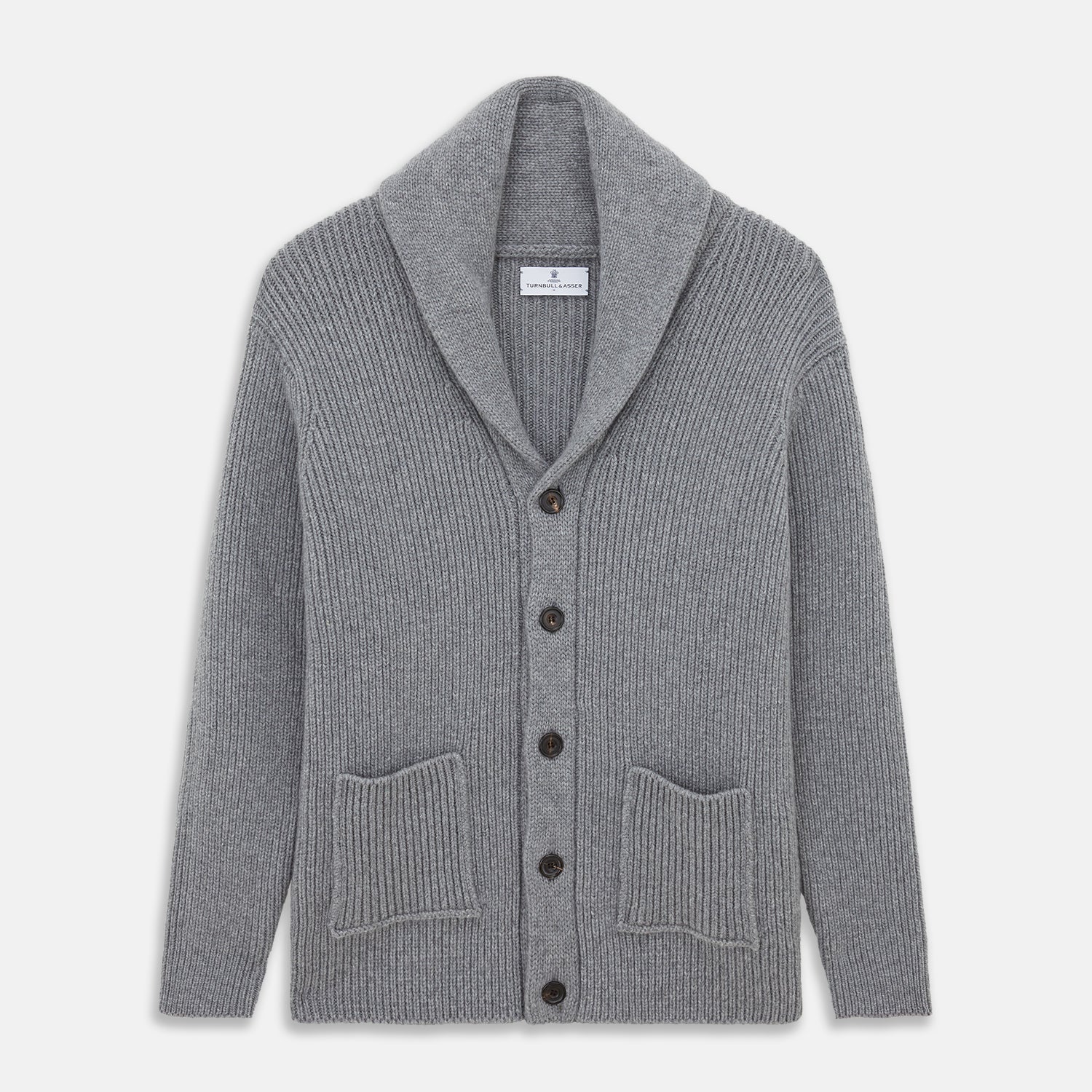 View 1 of product The Turnbull & Asser Grey Ribbed Cashmere Ainsley Cardigan is a luxury 3-ply cashmere knit with a shawl collar, button-up front, and two front pockets, shown laid flat on a white background.