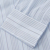View 3 of product Turnbull & Asser’s Blue and White Stripe Twill Cotton Regular Fit Shirt features a T&A collar, double cuffs, and classic stripes, shown laid flat on a white background.
