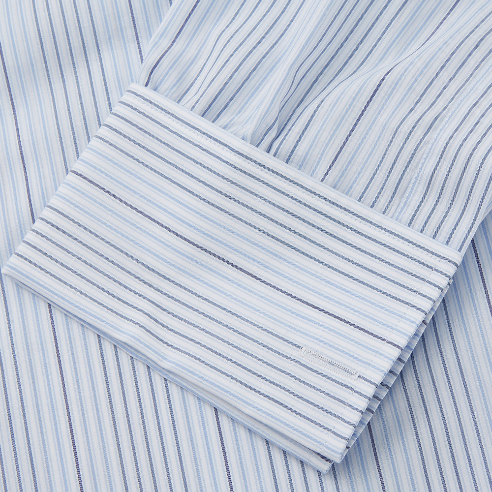 Turnbull & Asser’s Blue and White Stripe Twill Cotton Regular Fit Shirt features a T&A collar, double cuffs, and classic stripes, shown laid flat on a white background.