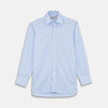 View 1 of product The Turnbull & Asser Light Blue Rich Stripe Shirt features a T&A collar, three-button cuffs, and fine white vertical stripes. Shown neatly laid flat on a white background.