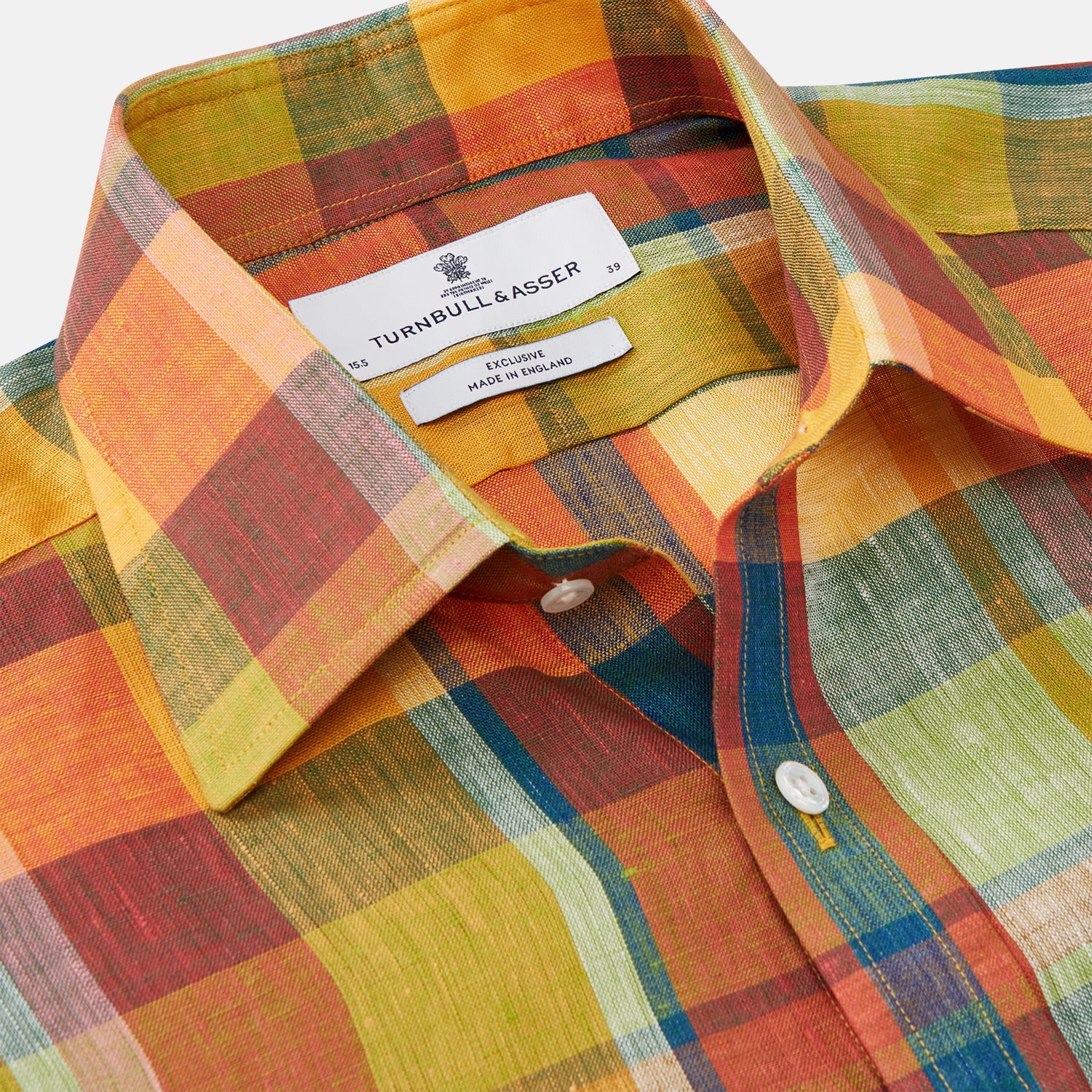 View 2 of product The Turnbull & Asser Orange Madras Check Regular Fit Linen Shirt features a T&A collar, 3-button cuffs, and a vibrant multicolor plaid pattern, shown on a white background.