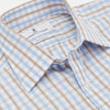 View 2 of product The Turnbull & Asser Blue and Brown Check Poplin Shirt features a T&A collar, 3-button cuffs, and a regular fit cotton construction, shown laid flat against a white background.