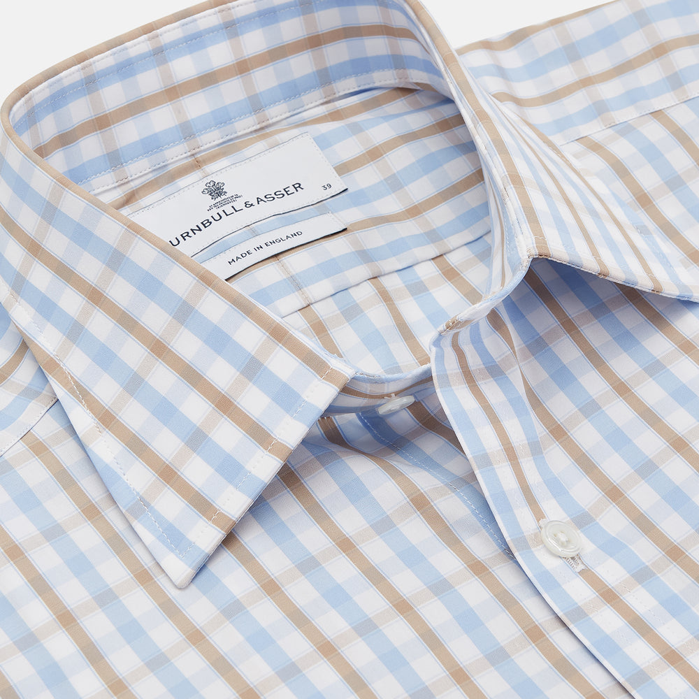The Turnbull & Asser Blue and Brown Check Poplin Shirt features a T&A collar, 3-button cuffs, and a regular fit cotton construction, shown laid flat against a white background.