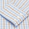 View 3 of product The Turnbull & Asser Blue and Brown Check Poplin Shirt features a T&A collar, 3-button cuffs, and a regular fit cotton construction, shown laid flat against a white background.