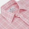 View 2 of product The Turnbull & Asser Pink Fine Check Shirt features superfine cotton Zephir, a T&A collar, and three-button cuffs, shown laid flat on a white background.