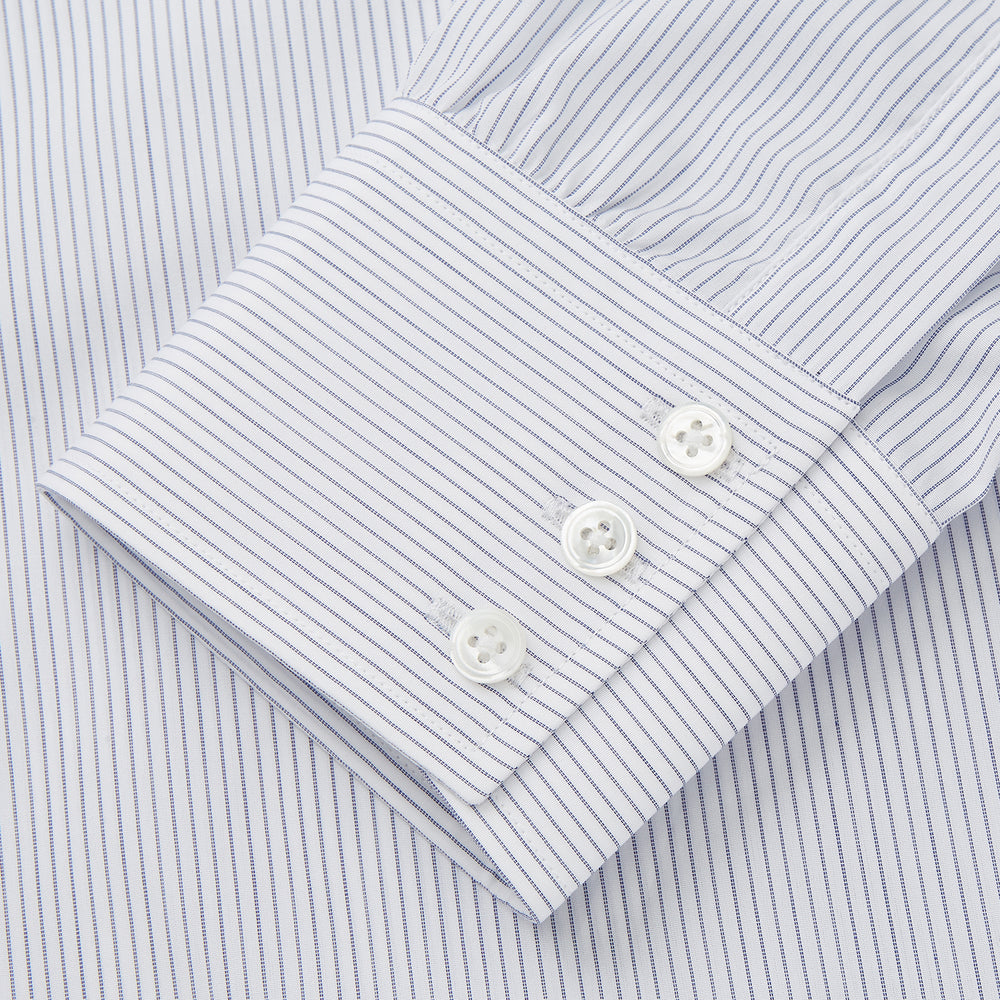 The Turnbull & Asser White and Blue Stripe Sea Island Quality Cotton Shirt features a T&A collar, 3-button cuffs, and fine vertical stripes, displayed on a white background.