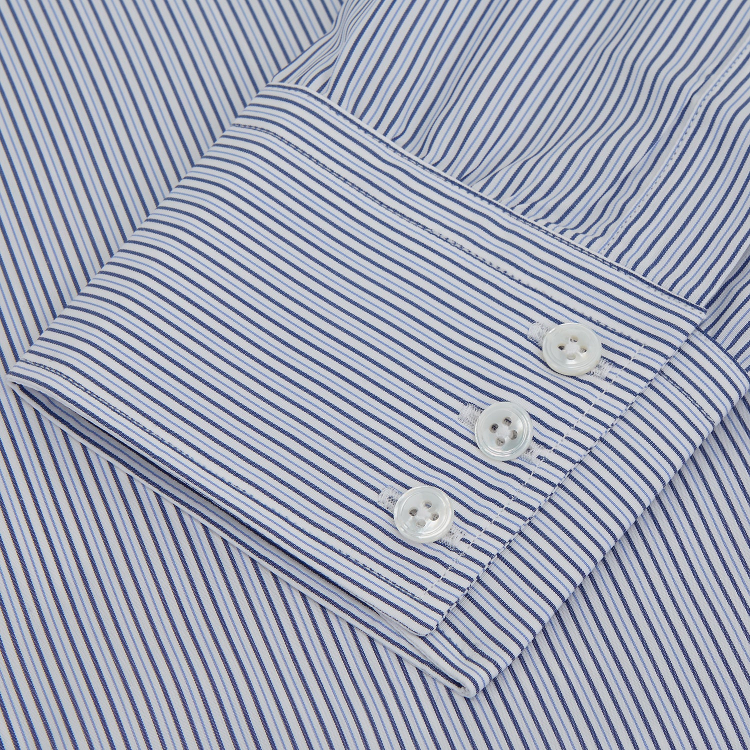 View 3 of product A Turnbull & Asser Blue and White Stripe Sea Island Quality Cotton Shirt, featuring a T&A collar and 3-button cuffs, crafted from luxurious Egyptian cotton with light blue and white vertical stripes, is laid flat on a white background.