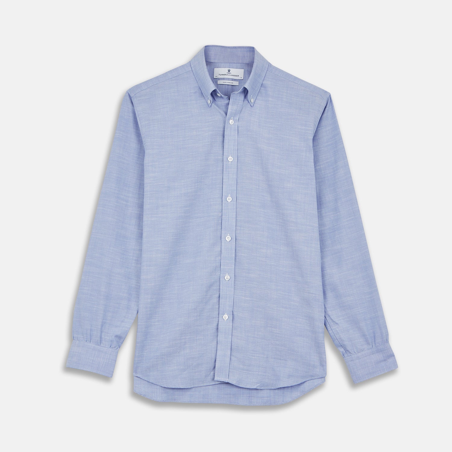 View 1 of product The Turnbull & Asser Blue Chambray Weekend Fit Shirt features a Dorset collar, 1-button cuffs, and white buttons, shown flat on a white background.