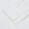 View 2 of product The Turnbull & Asser White Herringbone Tailored Fit Cotton Shirt features a long point collar, 2-button cuff, and button-down front, shown laid flat on a white background.