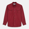 View 1 of product The Turnbull & Asser Burgundy Corduroy Officer Weekend Fit Shirt features a Dorset collar, long sleeves, one-button cuffs, and two chest pockets with buttoned flaps, shown laid flat on a white background.