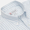 View 3 of product The Turnbull & Asser Weekend Fit Blue Stripe Cotton Shirt with Dorset collar and 1-button cuffs is laid flat on a white background, showcasing its classic long sleeves, striped design, and button-down front.