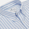 View 2 of product The Turnbull & Asser Blue and White Bengal Stripe Oxford Weekend Fit Shirt features a Dorset collar and 1-button cuffs, shown laid flat on a white background.
