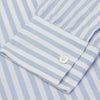 View 3 of product The Turnbull & Asser Blue and White Bengal Stripe Oxford Weekend Fit Shirt features a Dorset collar and 1-button cuffs, shown laid flat on a white background.