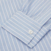 View 3 of product The Turnbull & Asser Blue and White Broad Stripe Oxford Weekend Fit Shirt features a Dorset collar, 1-button cuffs, and classic stripes—ideal for smart-casual days. Laid flat on a white background.