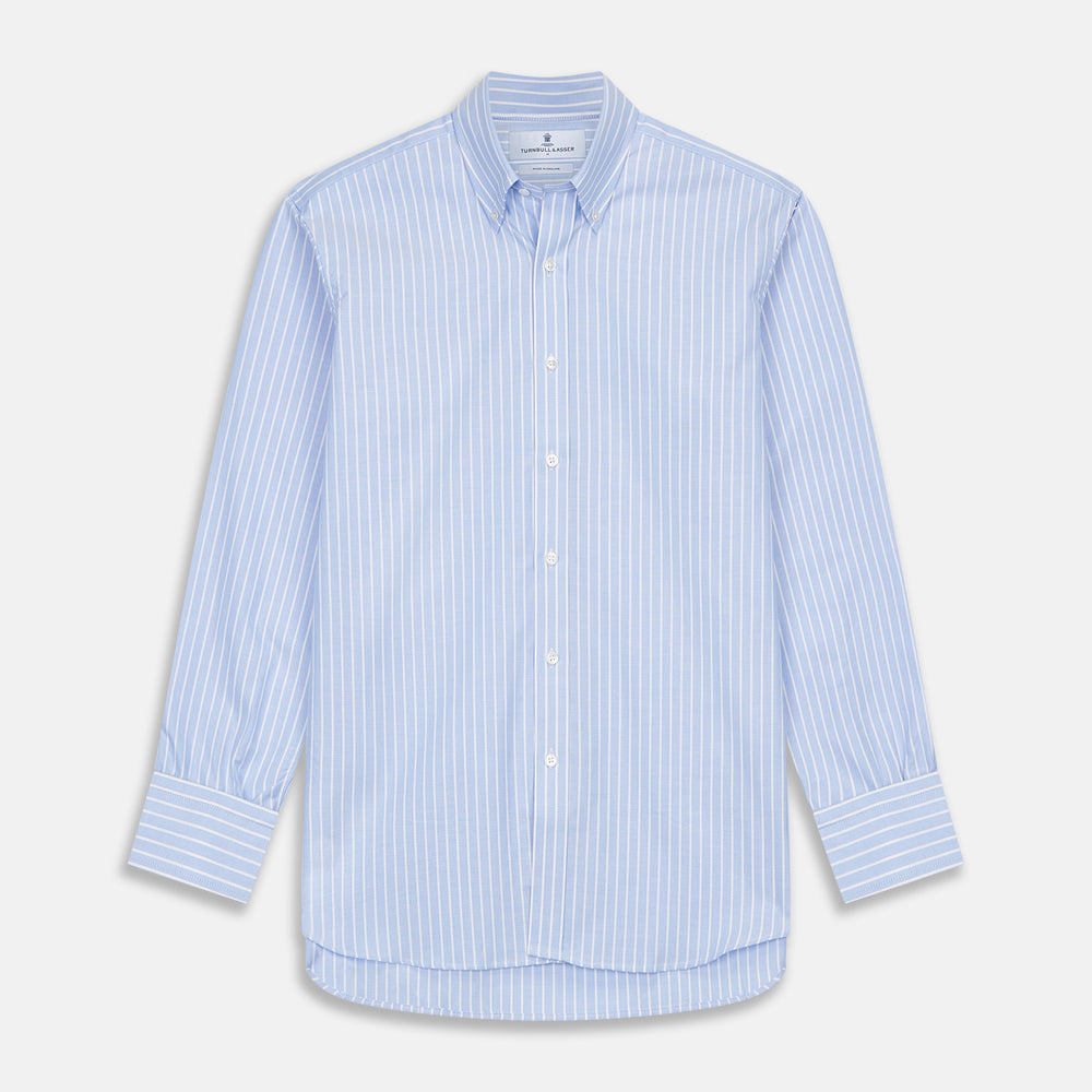 The Turnbull & Asser Blue and White Broad Stripe Oxford Weekend Fit Shirt features a Dorset collar, 1-button cuffs, and classic stripes—ideal for smart-casual days. Laid flat on a white background.