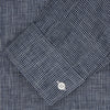 View 2 of product The Turnbull & Asser Weekend Fit Navy Check Linen Shirt features a Derby collar, left chest pocket, 1-button cuffs, and white buttons in textured microcheck fabric, shown laid flat on a white background.