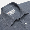View 3 of product The Turnbull & Asser Weekend Fit Navy Check Linen Shirt features a Derby collar, left chest pocket, 1-button cuffs, and white buttons in textured microcheck fabric, shown laid flat on a white background.