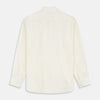 View 5 of product The Turnbull & Asser Cream Weekend Fit Larkin Shirt features a Dorset collar, 3-button cuffs, and two button-flap chest pockets in soft herringbone cotton, displayed flat on a white background.