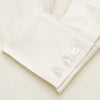 View 3 of product The Turnbull & Asser Cream Weekend Fit Larkin Shirt features a Dorset collar, 3-button cuffs, and two button-flap chest pockets in soft herringbone cotton, displayed flat on a white background.