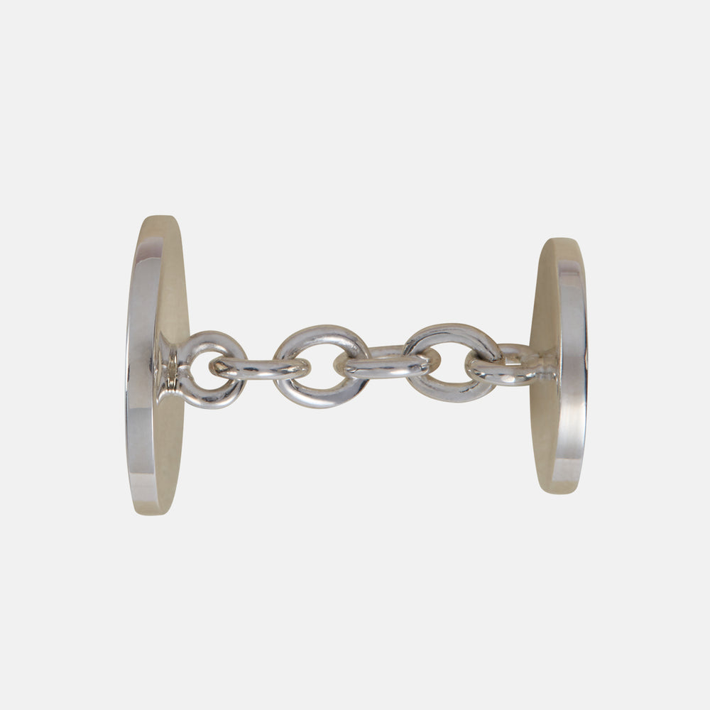 The Turnbull & Asser Sterling Silver Embossed Hatton Cufflinks feature engraved faces linked for double cuff shirts, displayed on a plain white background and inspired by Birmingham Jewellery Quarter craftsmanship.