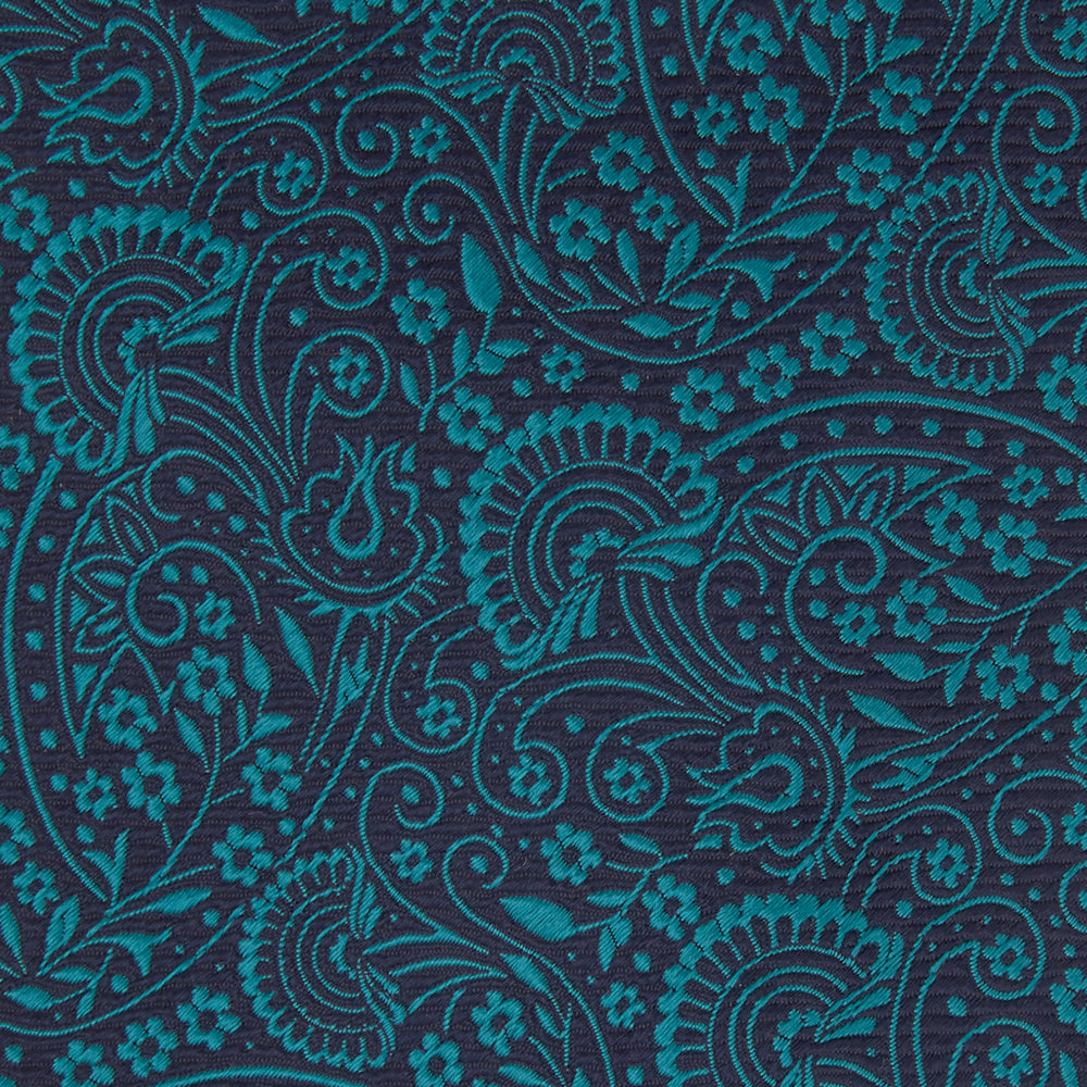 The Turnbull & Asser Green and Navy Tonal Paisley Silk Tie is an elegant men's accessory, featuring a rolled-up design with an intricate paisley pattern, shown on a white background.