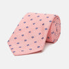 View 1 of product The Turnbull & Asser Pink Fine Square Slub Silk Tie features a pastel pink silk jacquard with blue and white geometric squares, shown rolled up on a plain white background.