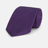 View 1 of product The Turnbull & Asser Purple Abstract Tonal Silk Jacquard Tie, featuring a textured geometric pattern, is shown rolled up against a white background—an ideal choice to elevate any formal outfit.