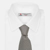 View 4 of product The Turnbull & Asser Fine Puppytooth Monochrome Silk Tie, in classic black and white, features a refined pattern and is shown rolled on a plain white background—ideal for enhancing any formal outfit.
