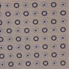 View 3 of product The Turnbull & Asser Beige Spheric Emblem Tie, a formalwear essential, features a neat roll and a repeating pattern of navy and white circular floral motifs on pastel beige.