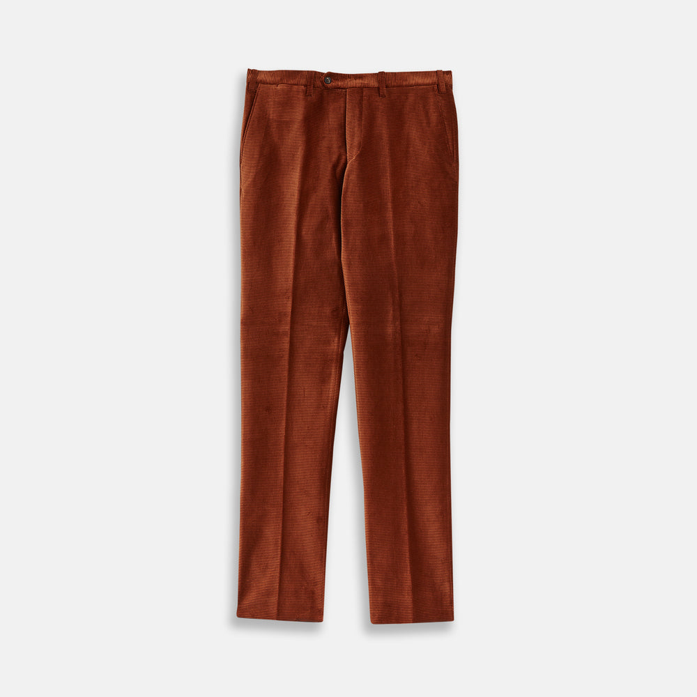 Turnbull & Asser’s Rust Horizontal Cord Trousers feature a straight-leg cut, front pockets, and button closure. Made from heavy-weight corduroy, these trousers are shown laid flat on a white background.
