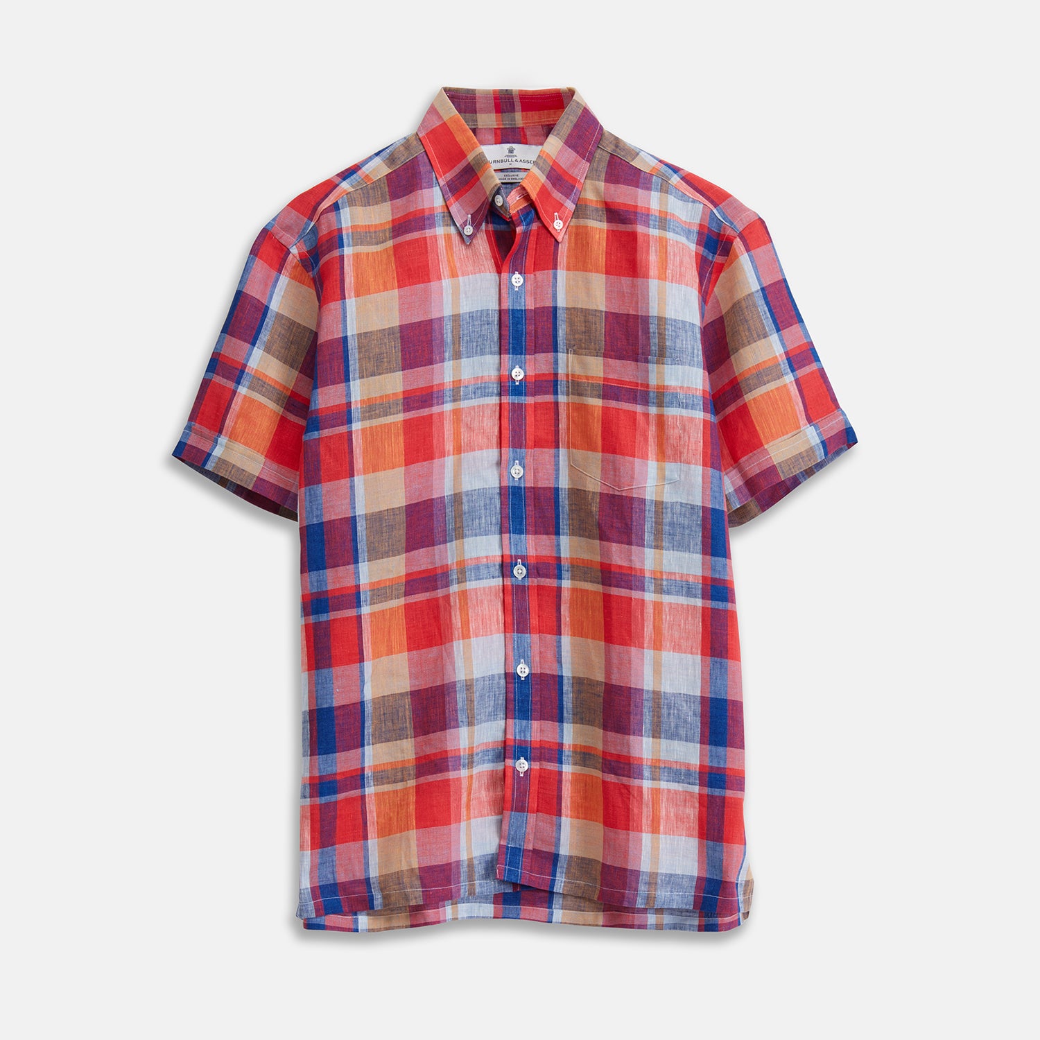 View 1 of product The Turnbull & Asser Red Madras Check Weekend Fit Short Sleeve Linen Shirt features a Dorset collar, white buttons, and a red, blue, white, and beige plaid pattern. Shown on a plain white background.