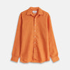 View 1 of product The Turnbull & Asser Orange Weekend Fit Long Sleeve Linen Shirt features a Derby collar, 1-button cuffs, white buttons, and a relaxed fit, shown against a white background.