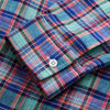 View 5 of product The Turnbull & Asser Green and Red Madras Check Weekend Fit Linen Shirt features a Derby collar, 1-button cuff, and colorful plaid pattern, crafted from sustainable linen and shown against a plain white background.