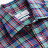 View 4 of product The Turnbull & Asser Green and Red Madras Check Weekend Fit Linen Shirt features a Derby collar, 1-button cuff, and colorful plaid pattern, crafted from sustainable linen and shown against a plain white background.