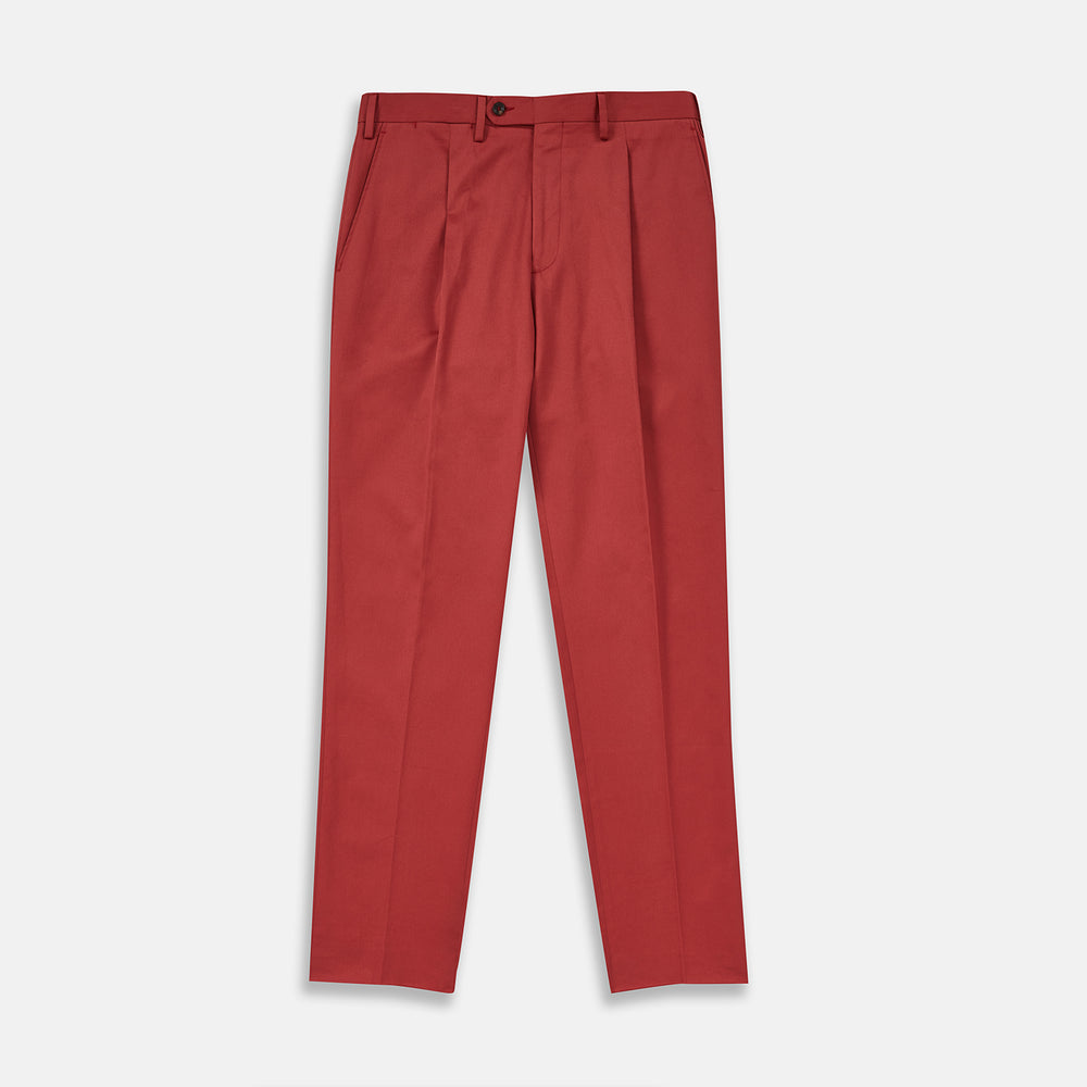 Turnbull & Asser Clay Red Cotton Twill Pleated Trousers feature a tailored fit, side pockets, and front button closure. Made in Italy, they're ideal for smart casual looks and are showcased against a plain white background.
