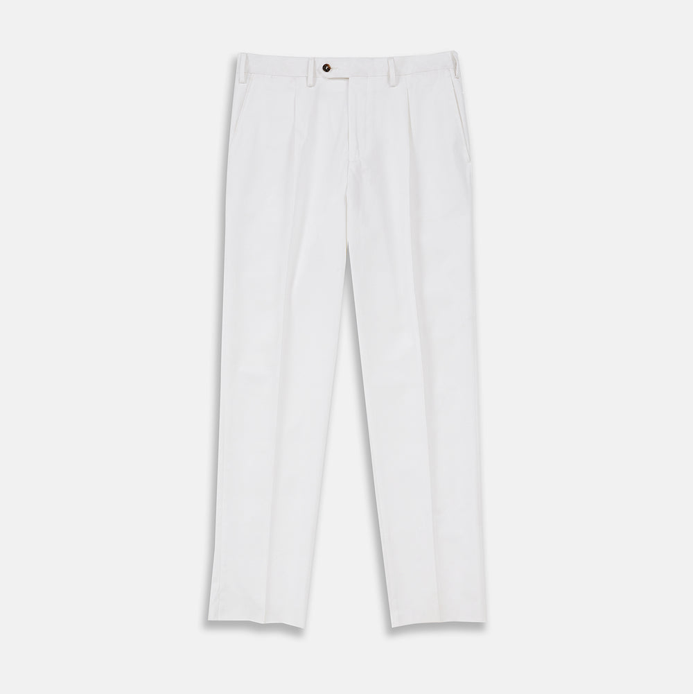 Turnbull & Asser’s White Cotton Pleated Trousers, a summer classic, are elegantly displayed against a crisp white backdrop.