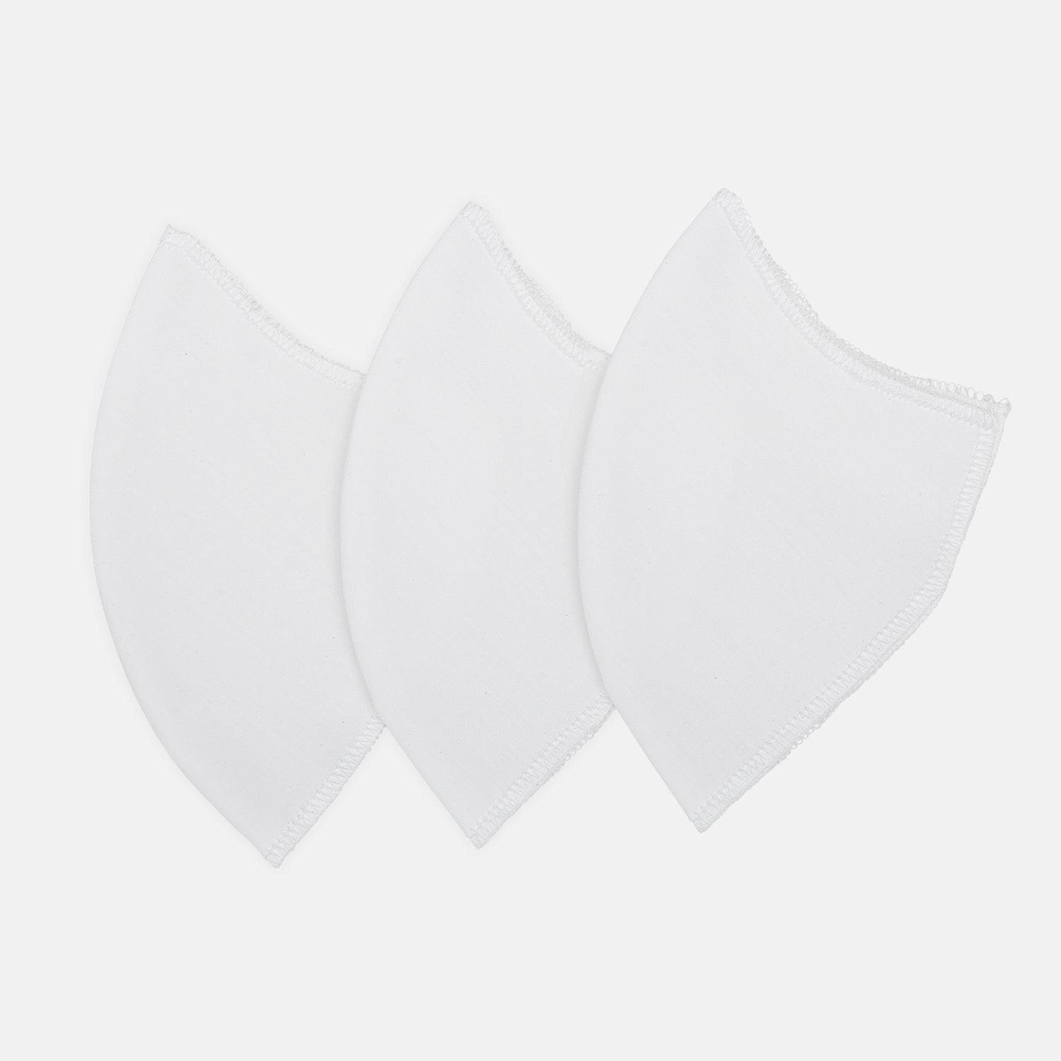View 1 of product Three white Turnbull & Asser Commuter Mask VIROFORMULA™ Filters (3-Pack) are displayed side by side on a plain white background, highlighting their antiviral and antibacterial properties.