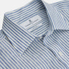 View 3 of product The Turnbull & Asser Sky Blue Linen Stripe Weekend Fit Shirt features blue and white vertical stripes, a Derby collar, and buttoned cuffs—ideal for pairing with classic cotton suits or other Weekend Fit shirts.