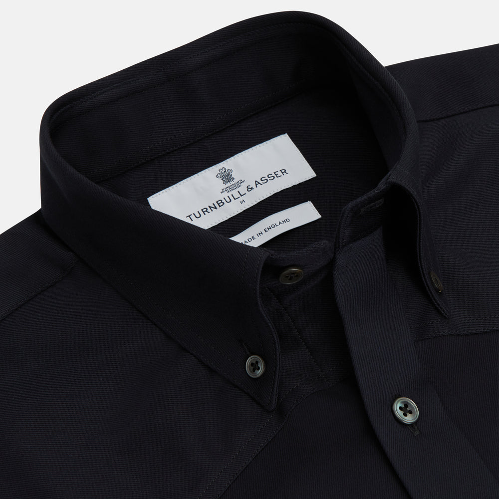 The Turnbull & Asser Navy Cotton Weekend Fit Western Shirt features a Dorset collar and two chest pockets with flaps, shown on a white background—ideal for smart-casual style.