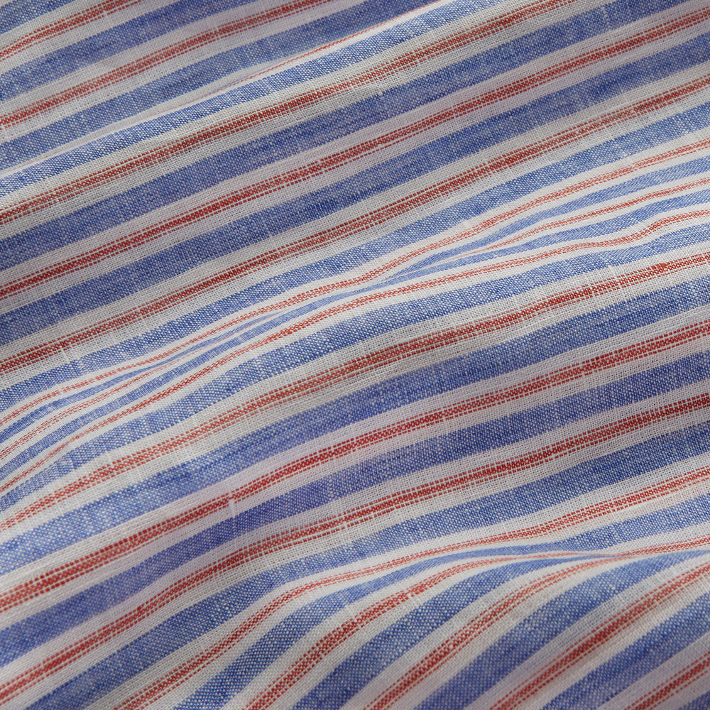 The Turnbull & Asser Blue and Red Linen Stripe Holiday Fit Shirt features a revere collar, relaxed fit, and short sleeves—perfect resort wear with vertical blue, white, and light red stripes.