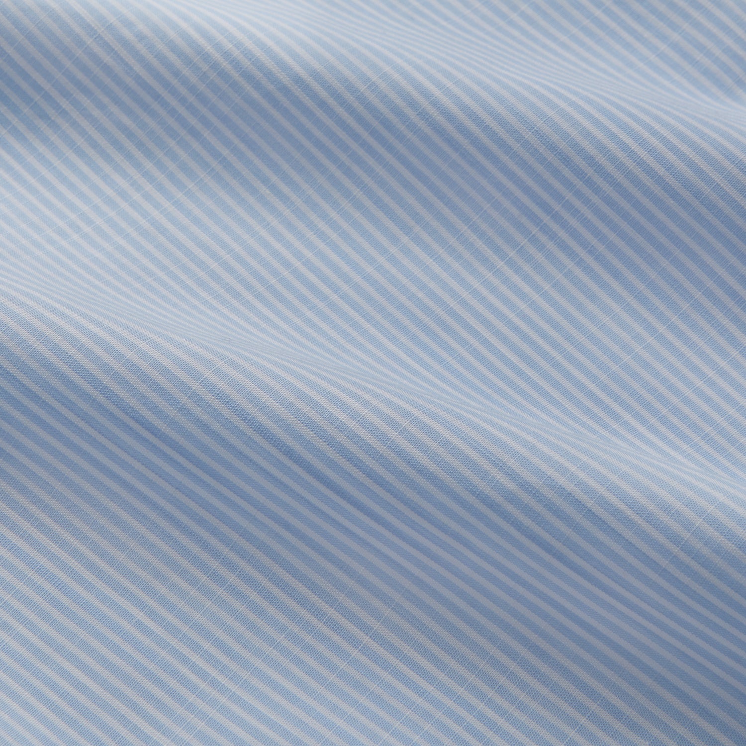 View 4 of product The Turnbull & Asser Sky Blue Chambray Stripe Weekend Fit Shirt features a Dorset collar, long sleeves, and two button-flap chest pockets, offering a relaxed look. Displayed on a plain white background.