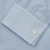View 3 of product The Turnbull & Asser Sky Blue Chambray Stripe Weekend Fit Shirt features a Dorset collar, long sleeves, and two button-flap chest pockets, offering a relaxed look. Displayed on a plain white background.